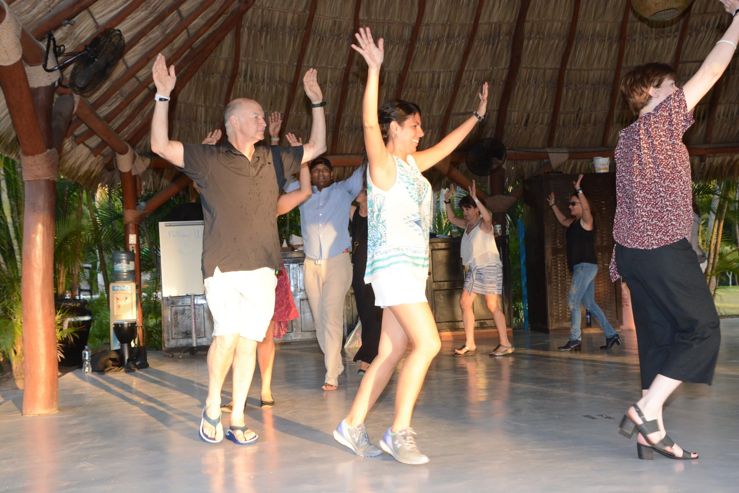 Executives learning a world dance together